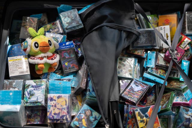 <p>Attendee shows his collection at 2023 Pokemon World Championships </p>