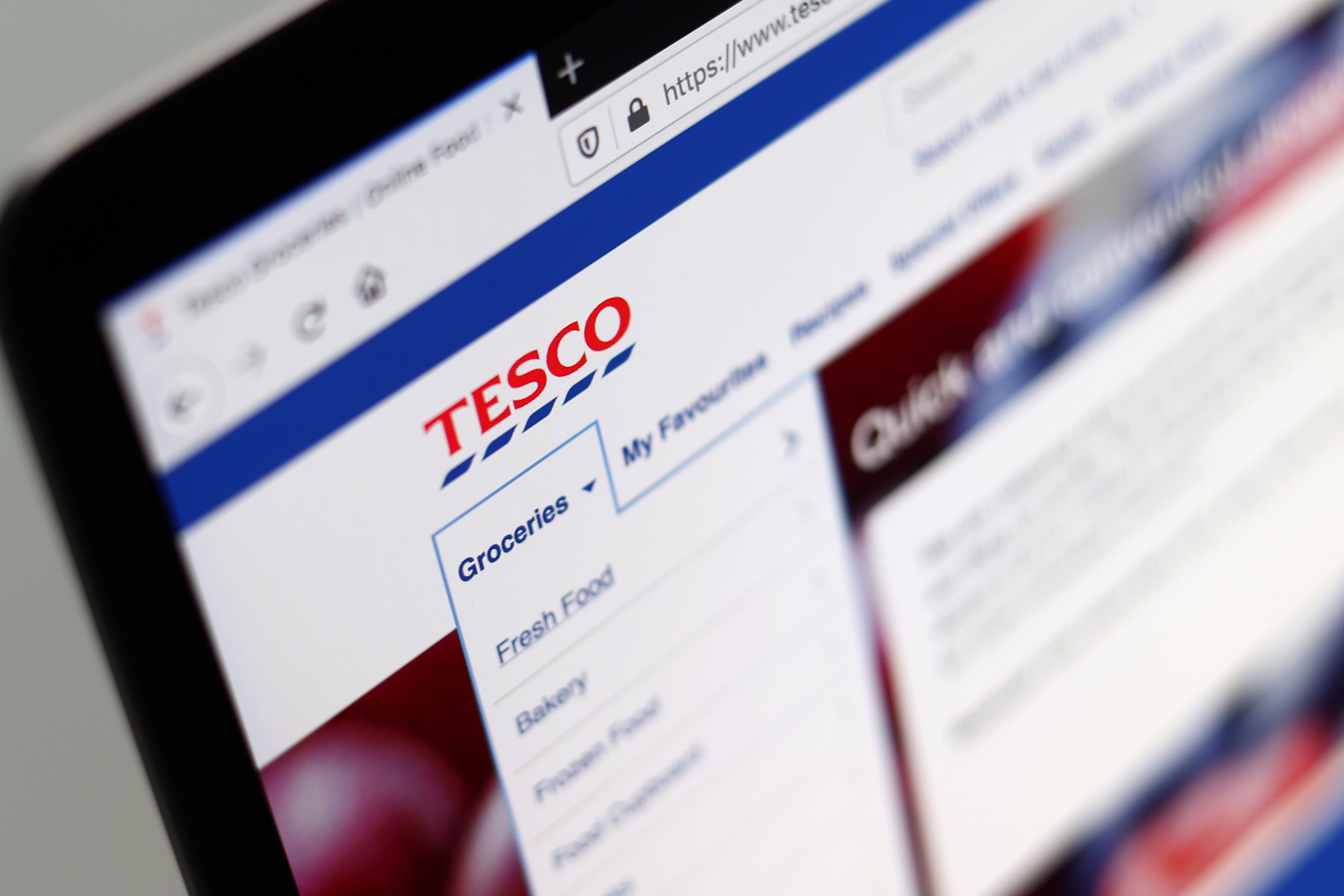 The Tesco website is pictured on a laptop (Tim Goode/PA)