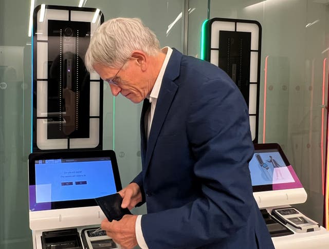 <p>Dodgy character? Simon Calder at entry-exit system kiosk at London St Pancras International</p>
