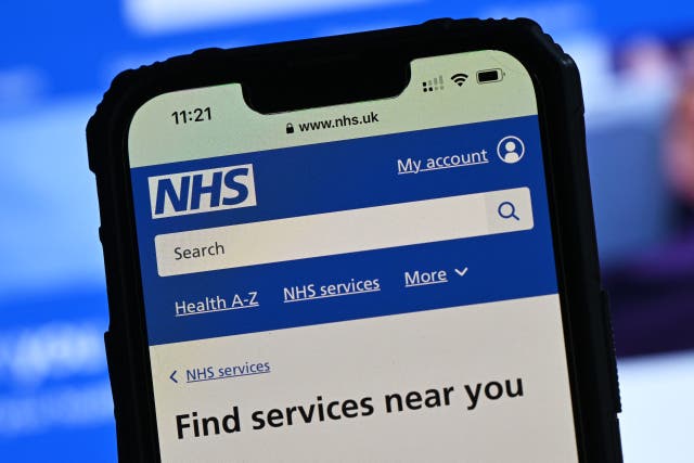 <p>The National Health Service (NHS) app displayed on a mobile phone screen</p>