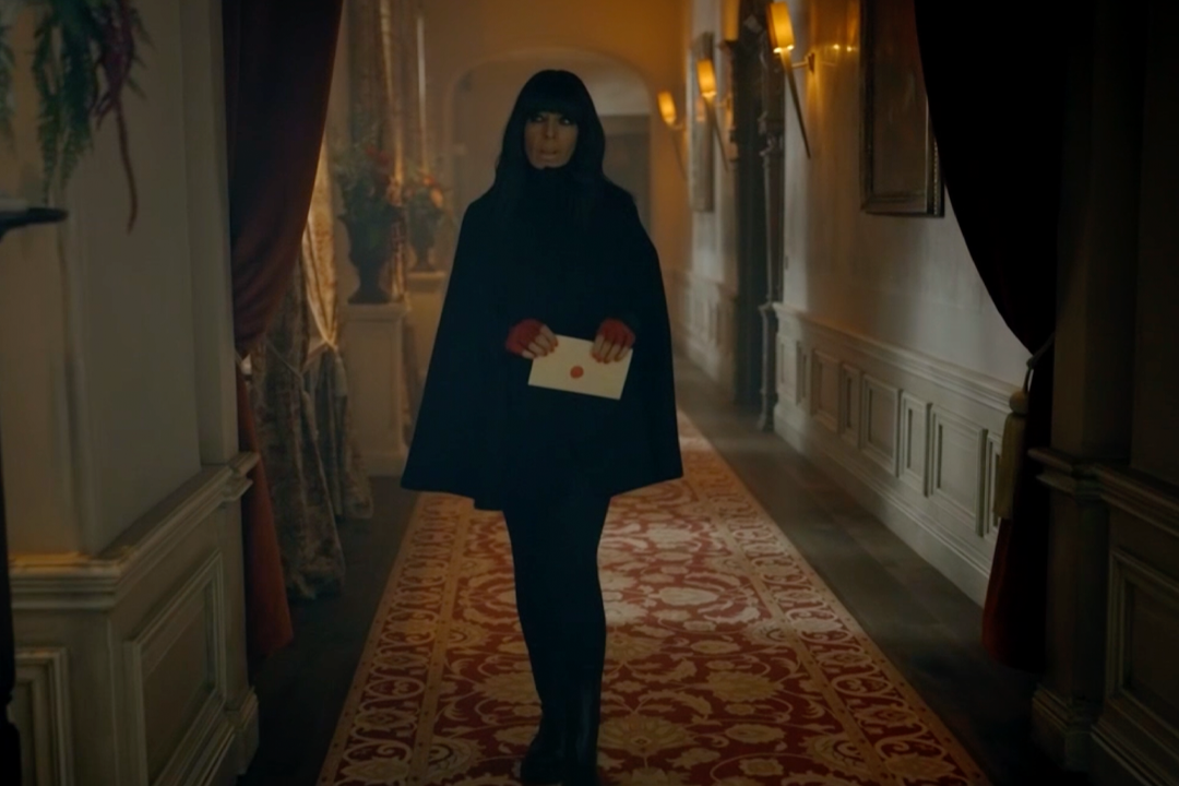 Claudia in her go-to wool black cape