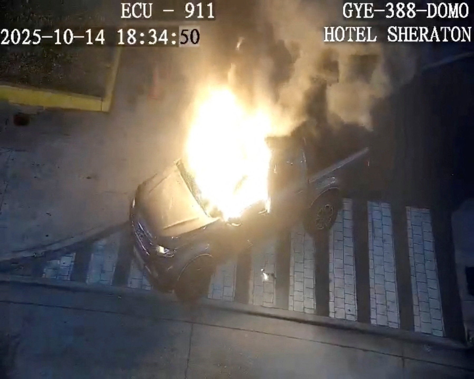 <p>Flames rise from a vehicle that exploded outside a shopping mall, in Guayaquil, Ecuador October 14, 2025 in this screengrab from CCTV video.    ECU 911/Handout via REUTERS    THIS IMAGE HAS BEEN SUPPLIED BY A THIRD PARTY. NO RESALES. NO ARCHIVES. MANDATORY CREDIT. OVERLAYS FROM SOURCE.  Verification Line: Reuters was able to confirm the location as buildings and roadmap layout match file and satellite images, as well as corroborating footages of the explosion</p>