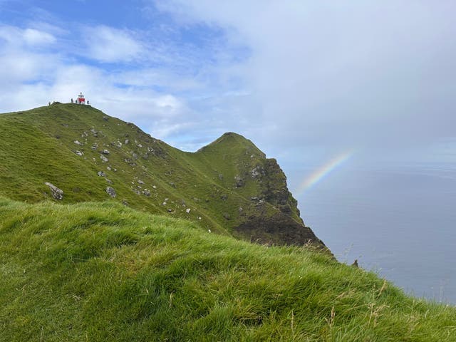 <p>A rainbow appears near a lighthouse on Kalsoy Island in Faroe Islands, Sept. 4, 2025. (AP Photo/Cara Anna)</p>
