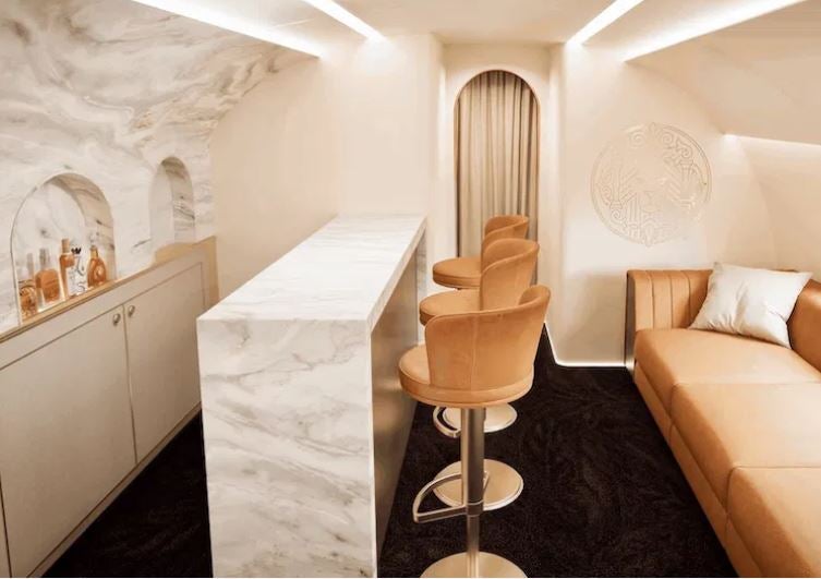 The image is a rendering of the in-flight bar on Magnifica Air