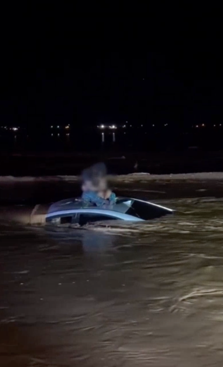 <p>Man and baby rescued from roof of car surrounded by floodwater
</p>