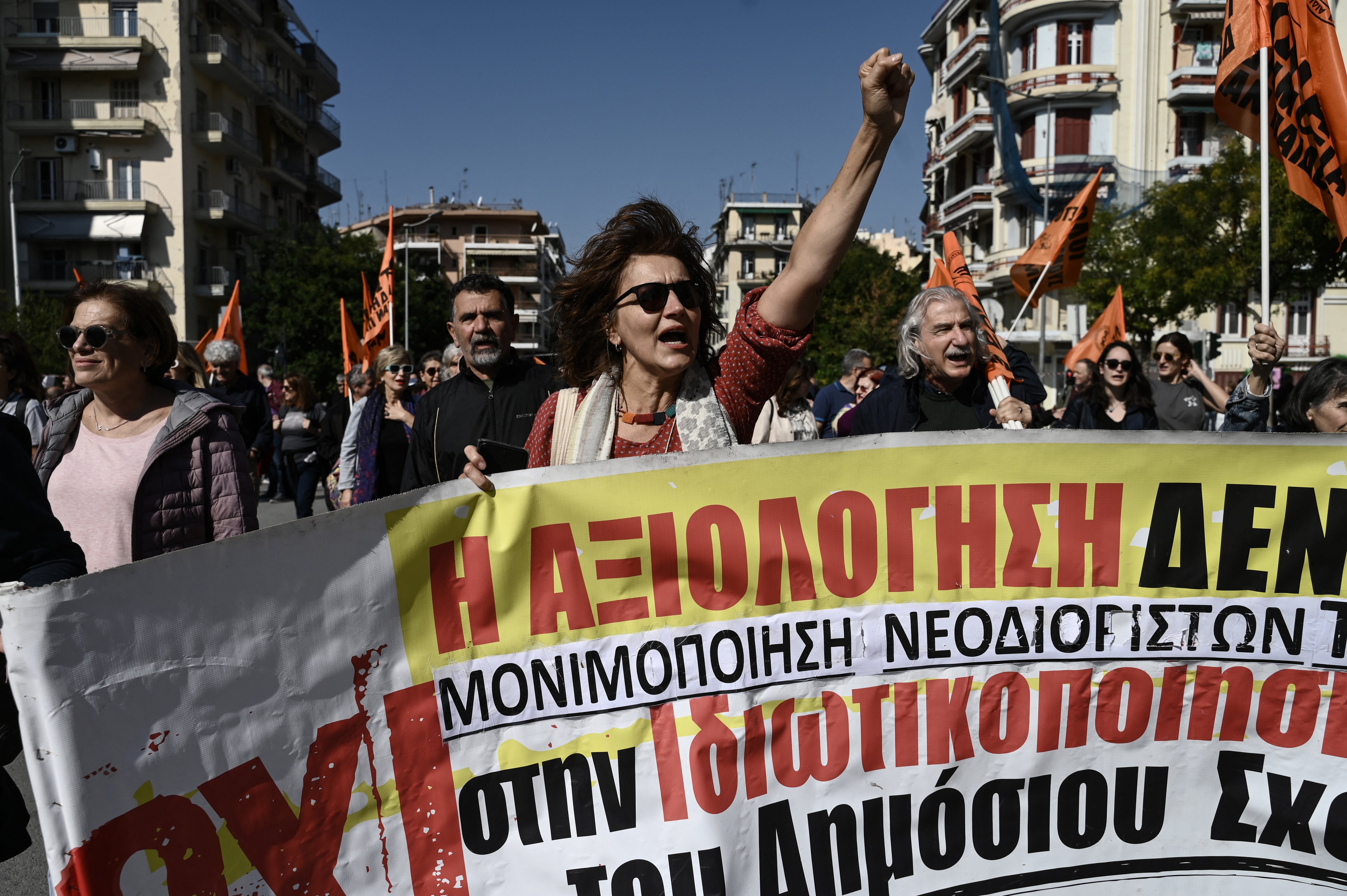 <p>Protestors shout slogans as they take part in a demonstration during a 24-hour strike against government plans introducing an optional 13-hour workday, in Thessaloniki</p>