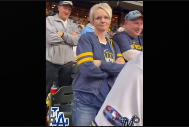 <p>A Brewers fan lost her job after suggesting she should 'call ICE' on a Latino Dodgers fan during a playoff game.</p>