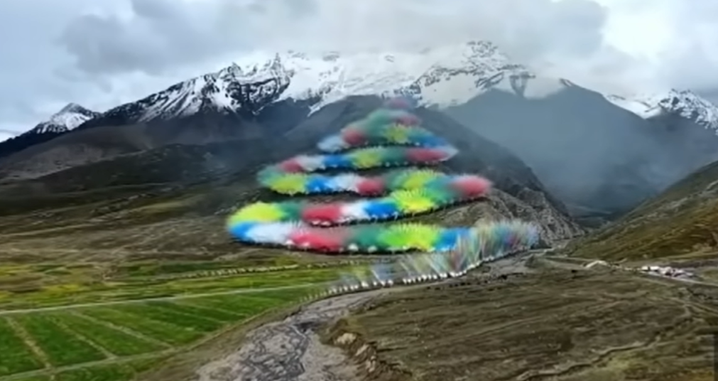 <p>Brightly coloured fireworks that apparently resembled a 'rising dragon' erupting over a lush Tibetan landscape</p>