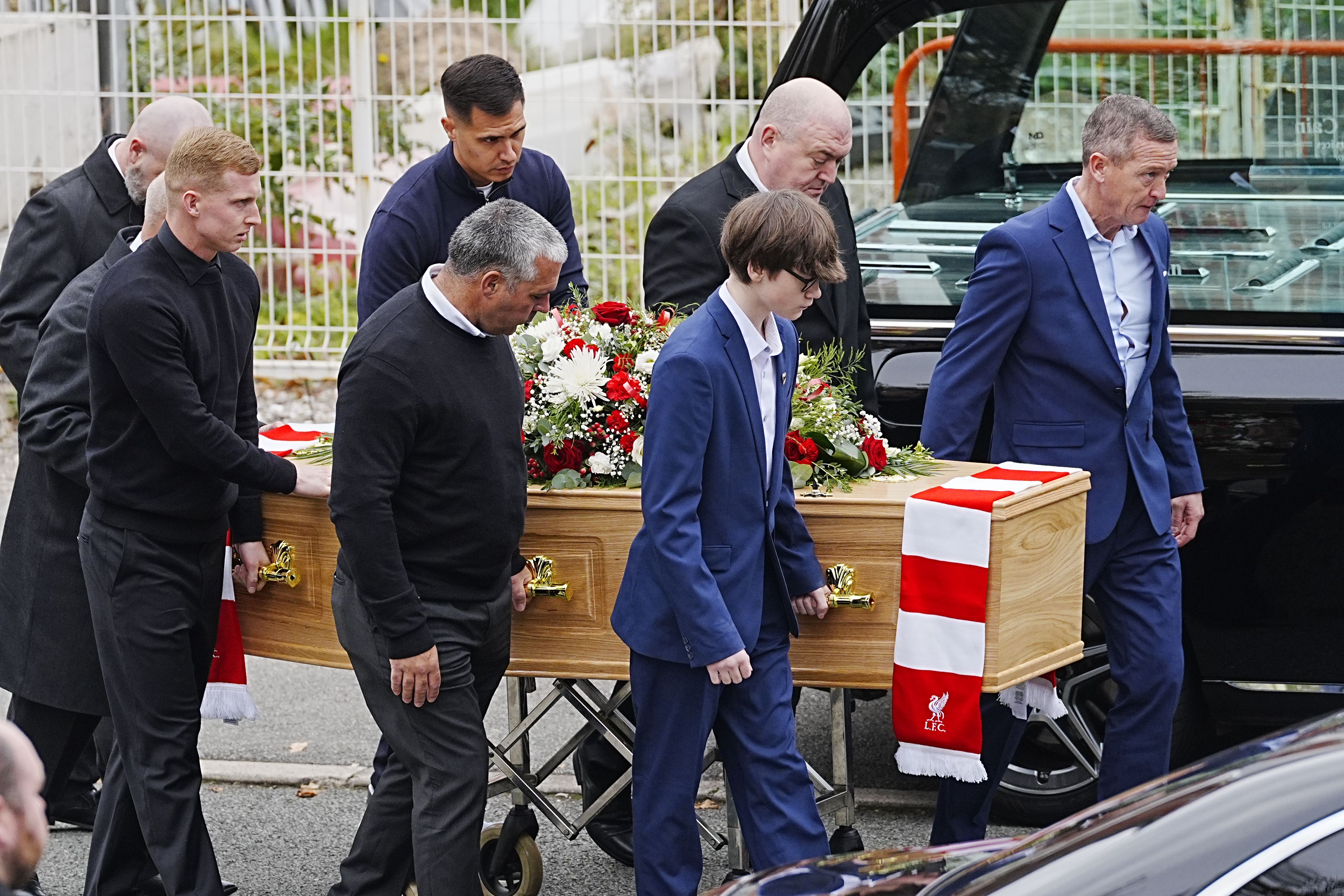 Matt Beard’s son Harry Beard (front right) and brother Mark Beard (front left) carrying his coffin before the memorial service in Liverpool (Peter Byrne/PA)