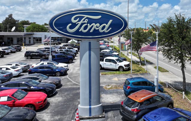 <p>MIAMI, FLORIDA - MAY 06: An aerial view as a Ford sign stands on the sales lot of the Metro Ford dealership on May 06, 2025 in Miami, Florida. Ford Motor Co. pulled its 2025 guidance and said it expects a tariff hit of about $1.5 billion for the year as U.S. automakers face economic uncertainty. (Photo by Joe Raedle/Getty Images)</p>