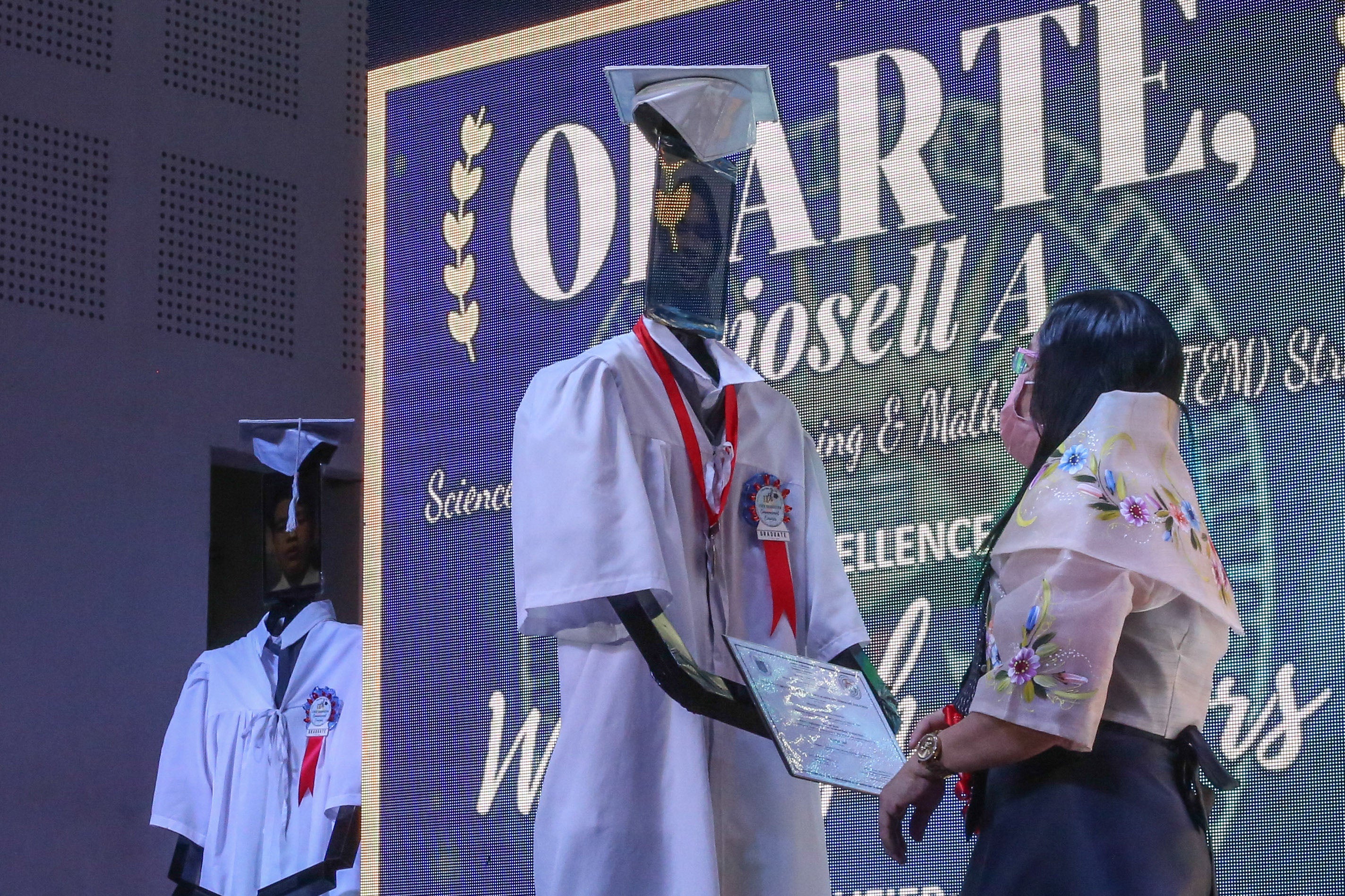 A robot stands in for a graduating high school student at a 'cyber graduation' ceremony in Manila, Philippines - perhaps predicting the future of the job market