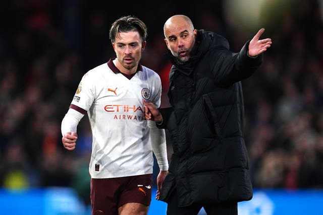 Pep Guardiola (right) has not ruled a Manchester City return for Jack Grealish (left) (Nick Potts/PA)