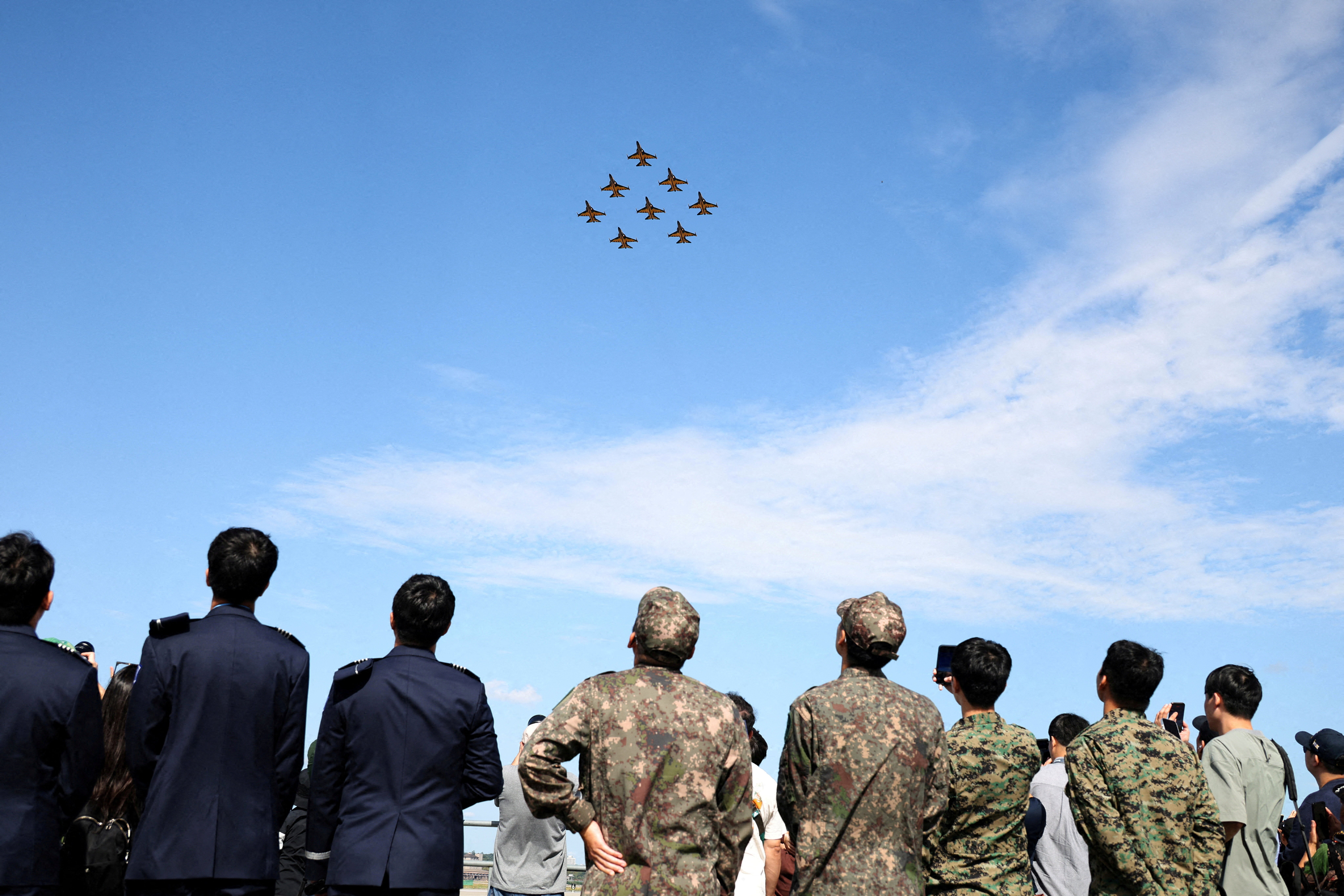 The South Korean Air Force Black Eagles aerobatic team perform during Seoul International Aerospace & Defense Exhibition (ADEX) in Seongnam, South Korea