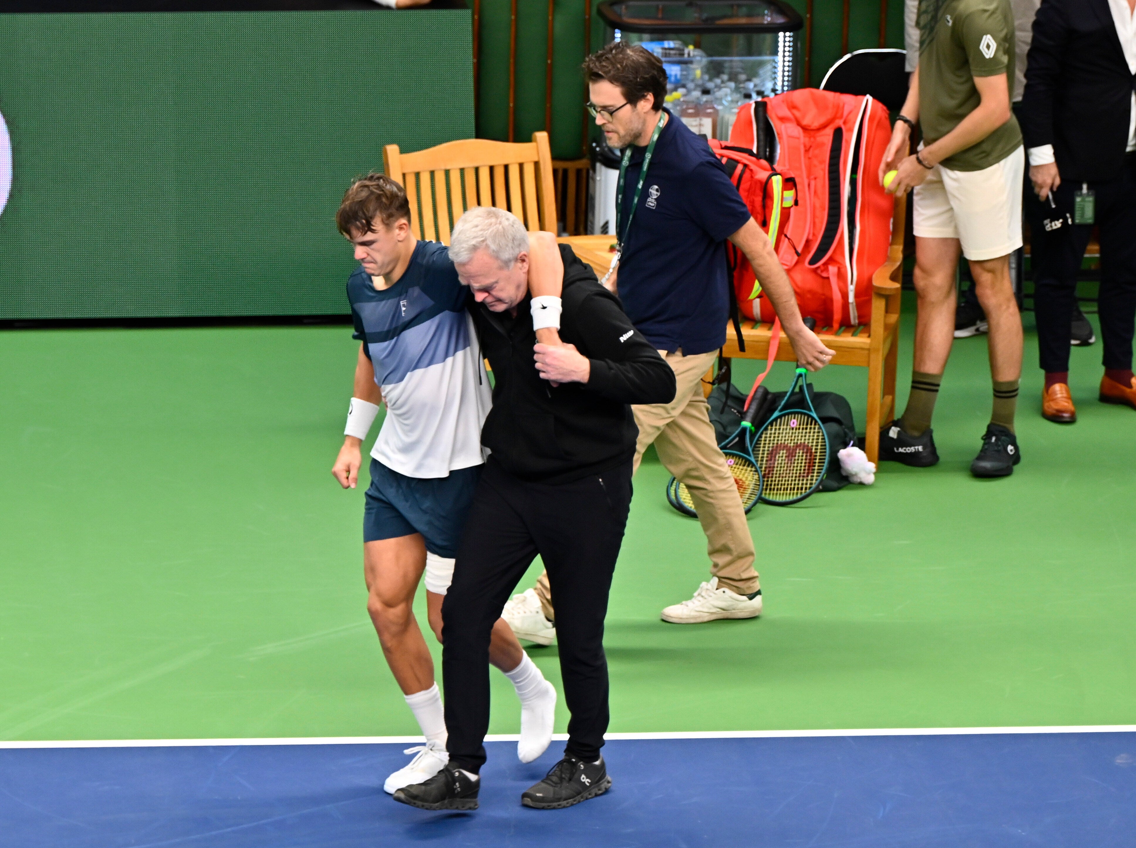 Rune was helped off the court following his retirement