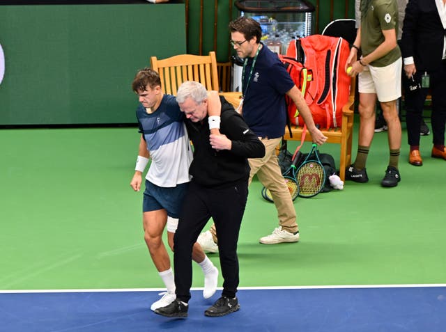 <p>Holger Rune was helped off the court</p>