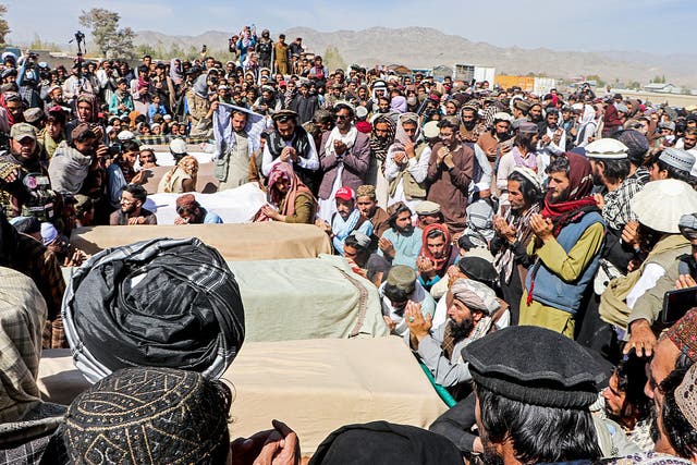 <p>Afghan mourners surround coffins of victims killed in aerial strikes by Pakistan</p>