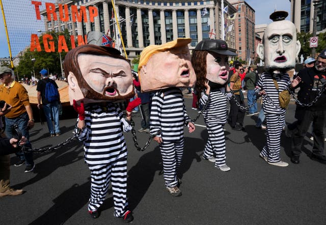<p>Demonstrators wearing costumes depicting U.S. President Donald Trump, U.S. Vice President JD Vance, U.S. Homeland Security Secretary Kristi Noem, and White House Deputy Chief of Staff Stephen Miller take part in a "No Kings" protest against U.S. President Donald Trump's policies, in Washington, D.C., U.S., October 18, 2025</p>