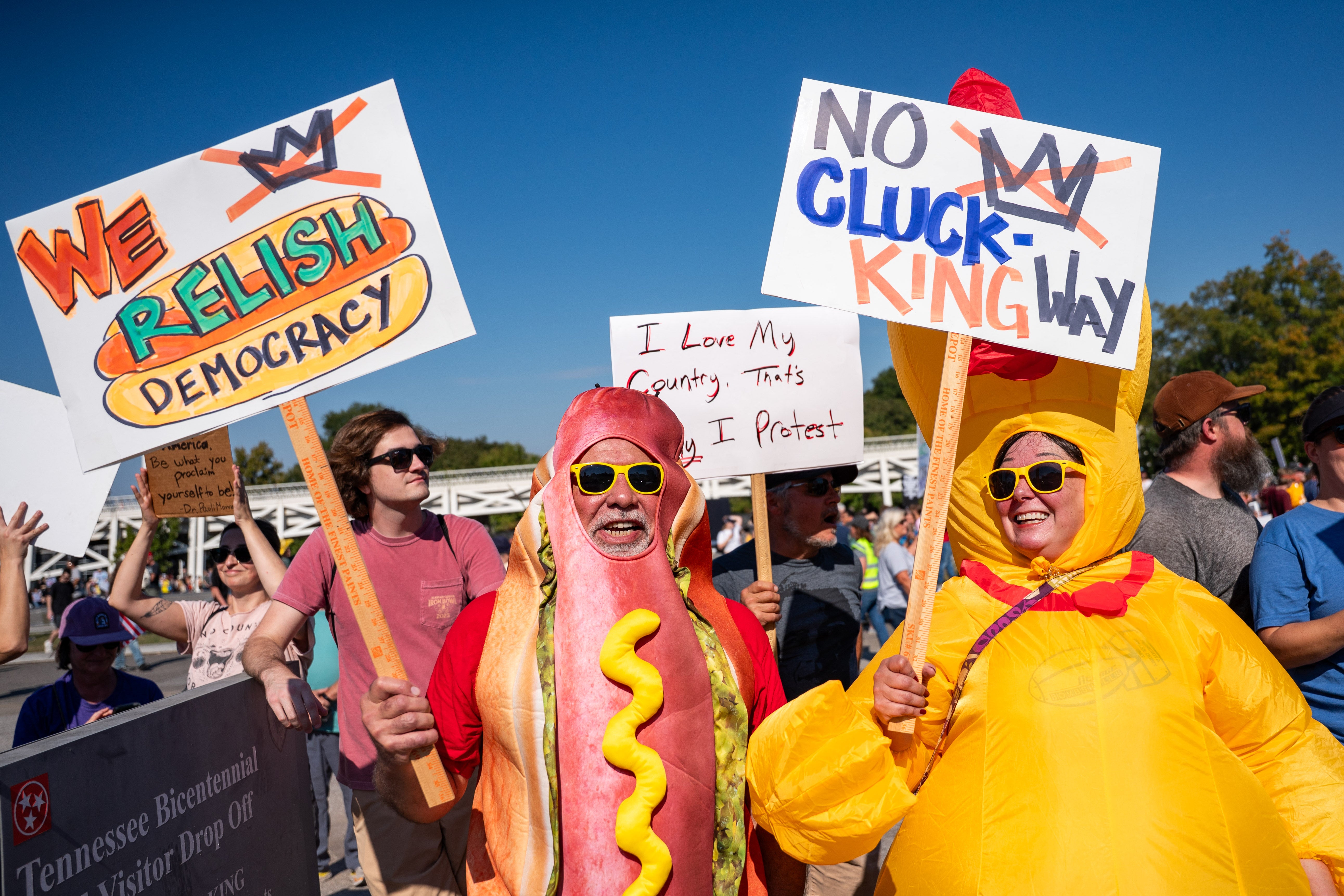 ‘We relish democracy’ was held up by a demonstrator dressed in a hot dog costume alongside others participating in the protests in Nashville, Tennessee
