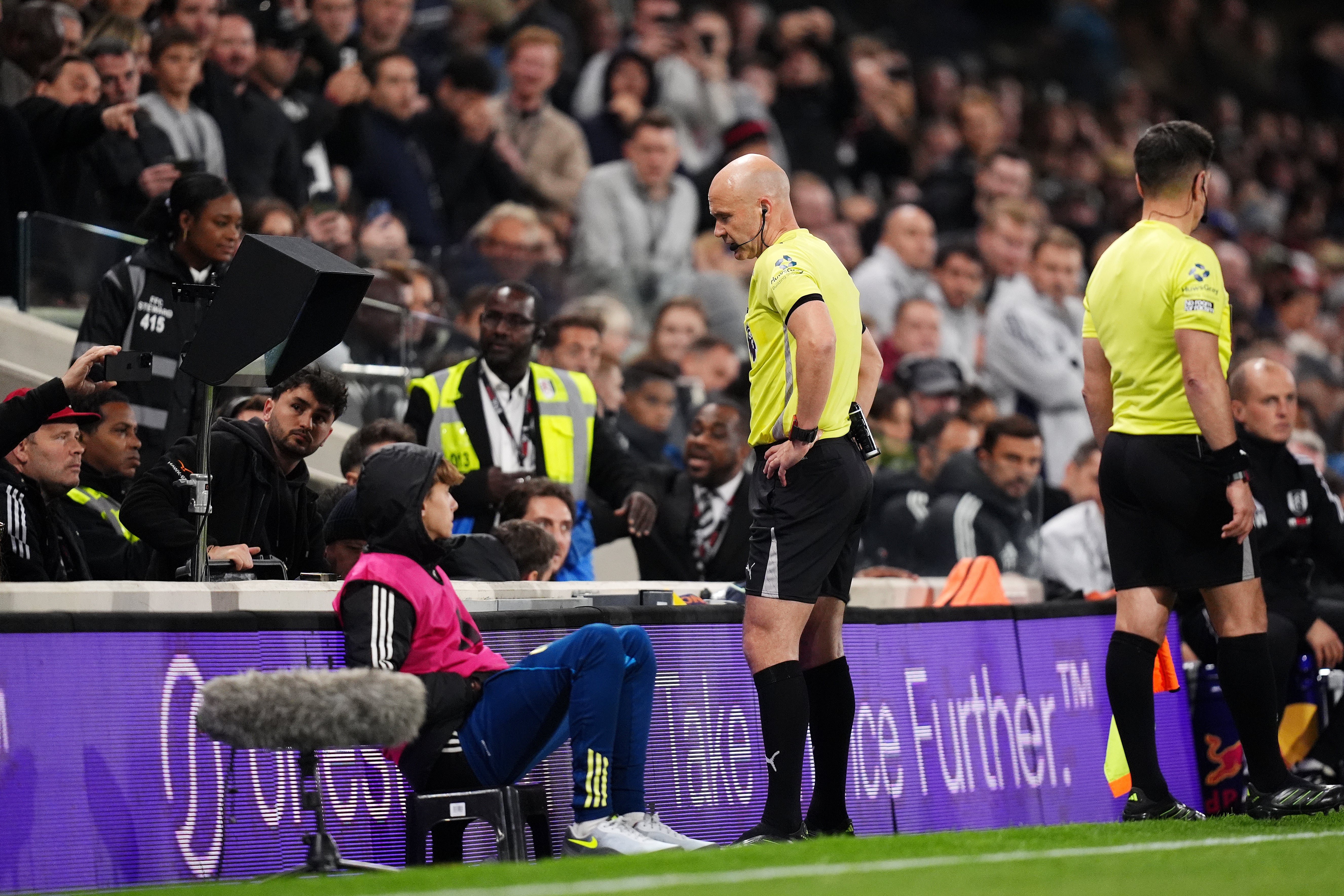 Referee Anthony Taylor is sent to the VAR monitor after awarding a penalty to Arsenal – which he overturned (John Walton/PA)