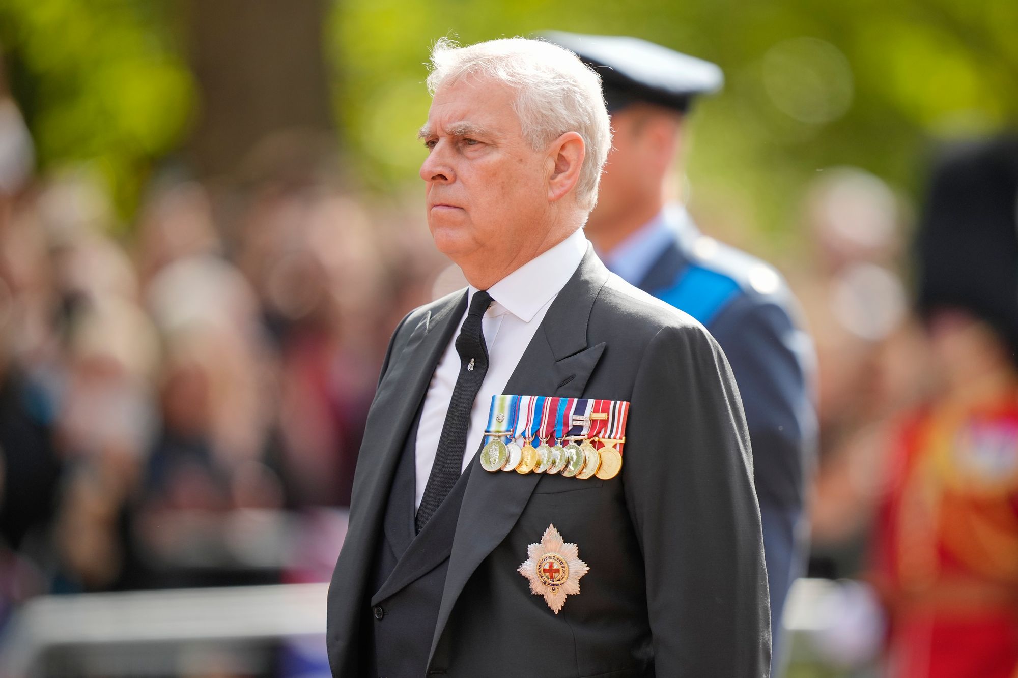 Prince Andrew walks behind the coffin during the ceremonial procession of the coffin of Queen Elizabeth II from Buckingham Palace to Westminster Hall on 14 September 2022