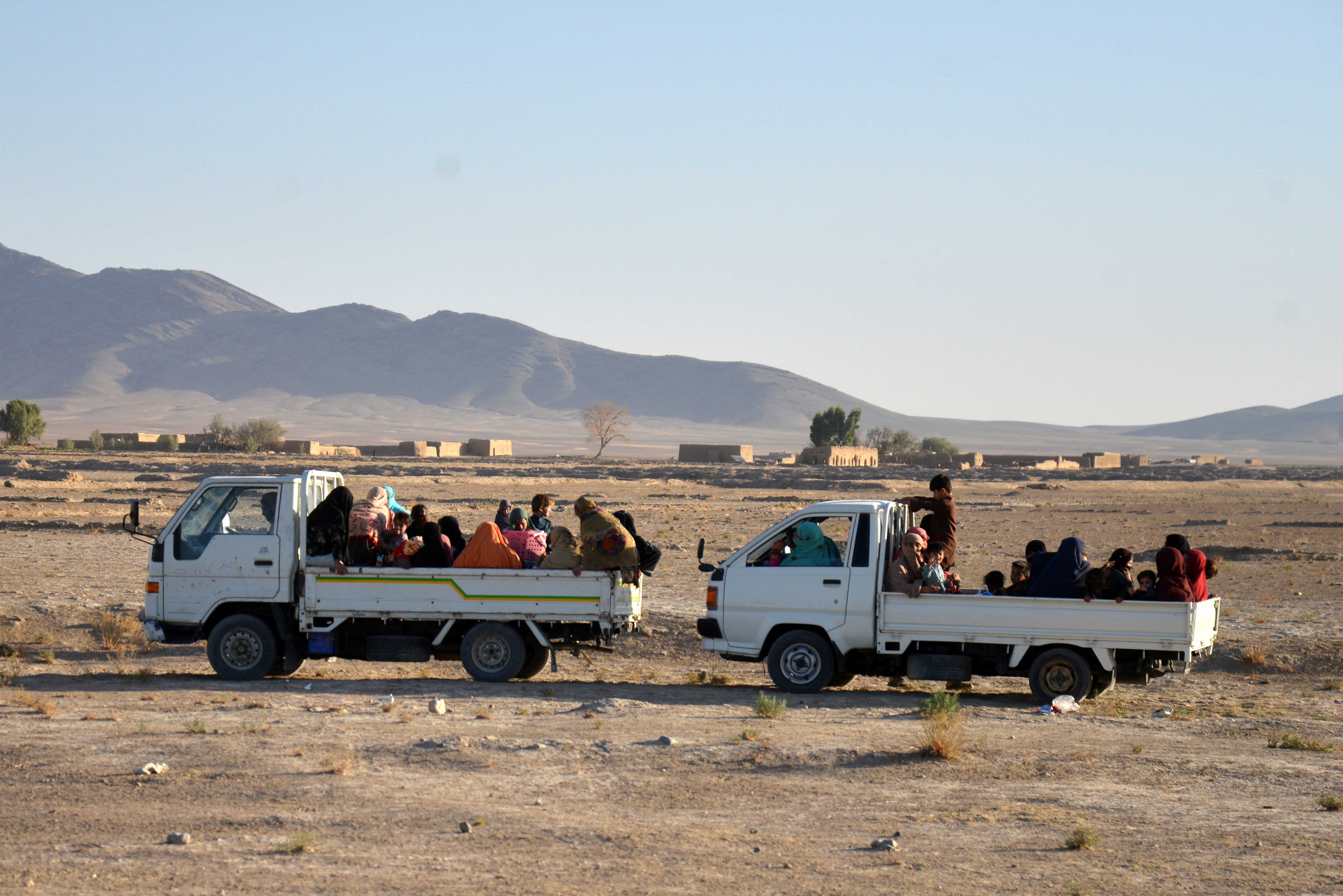 Afghan women and children are evacuated during clashes in the Spin Boldak area of Kandahar