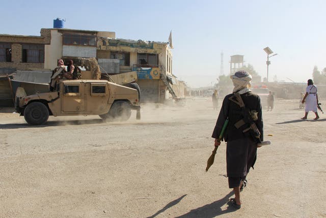 <p>Afghan Taliban fighters patrol in the border area of Spin Boldak following deadly clashes with Pakistani forces</p>