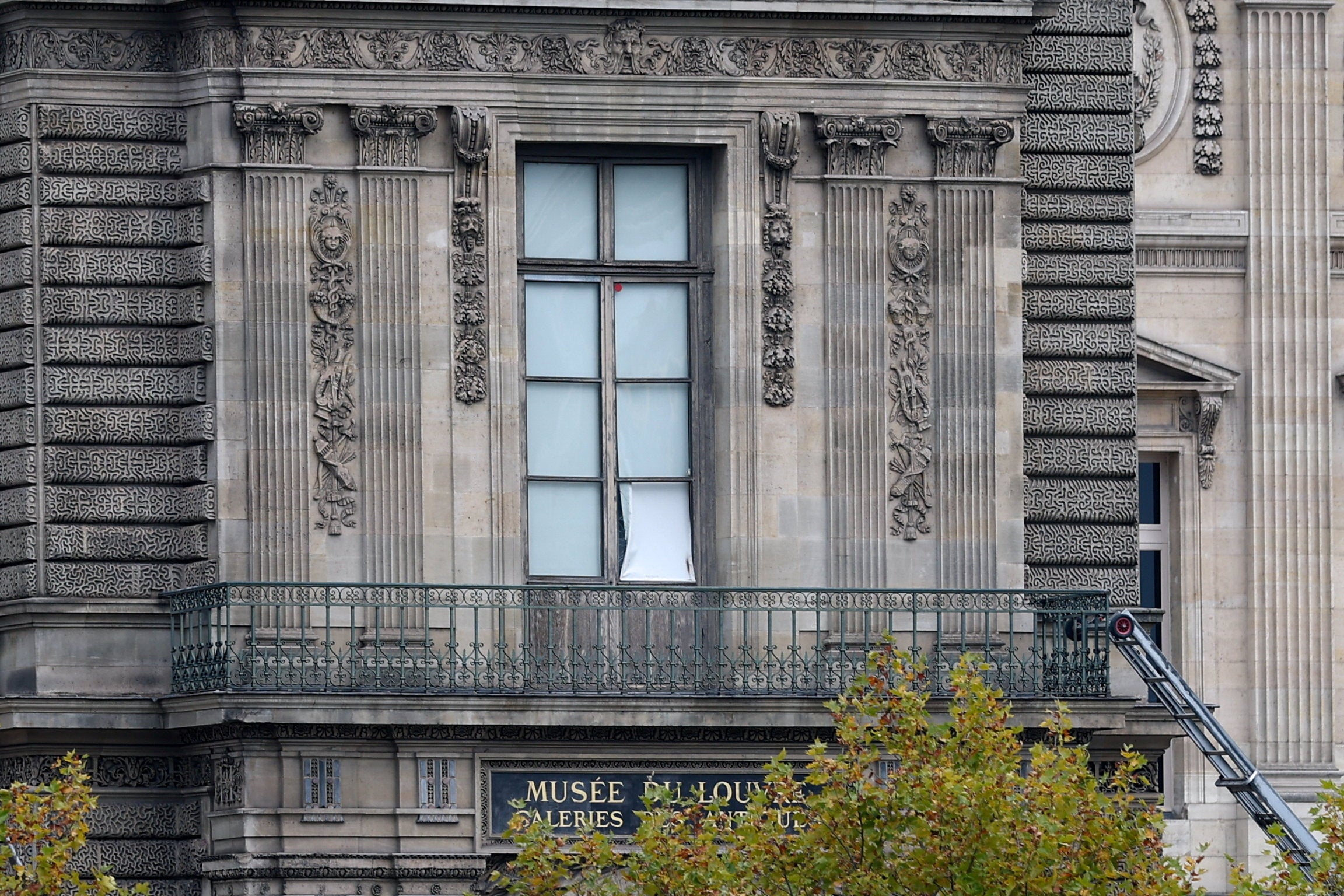 A window believed to have been used in what the French Interior Ministry says was a robbery at the Louvre