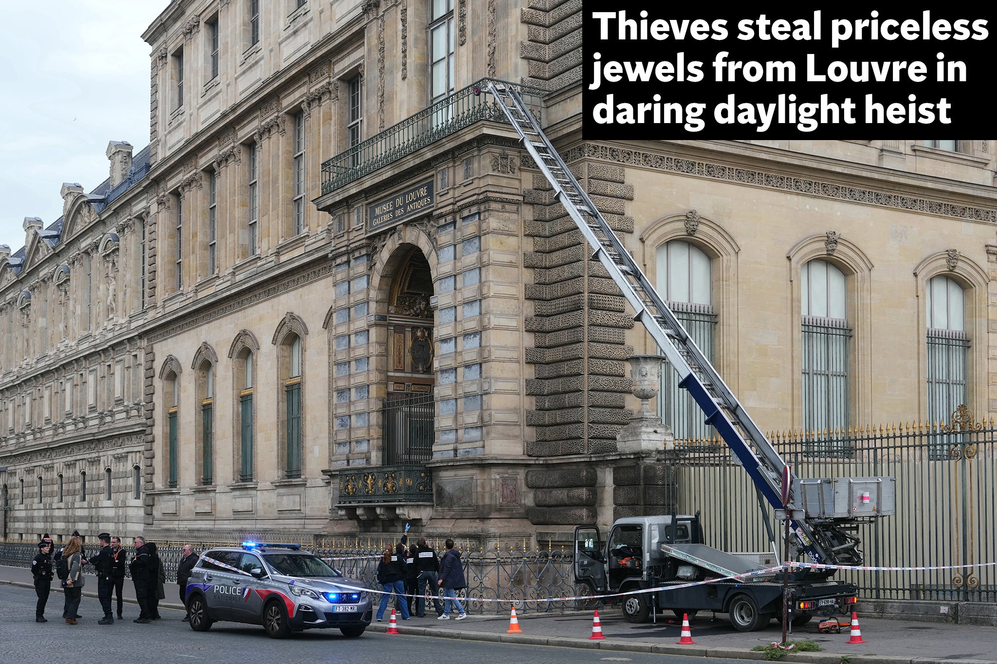 French police officers stand next to a furniture elevator used by robbers to enter the Louvre Museum (AFP/Getty)