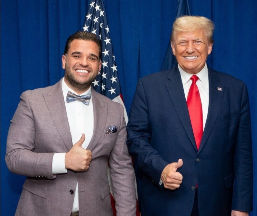 Mark Savaya, Donald Trump's new special envoy to Iraq, poses with Trump in a picture