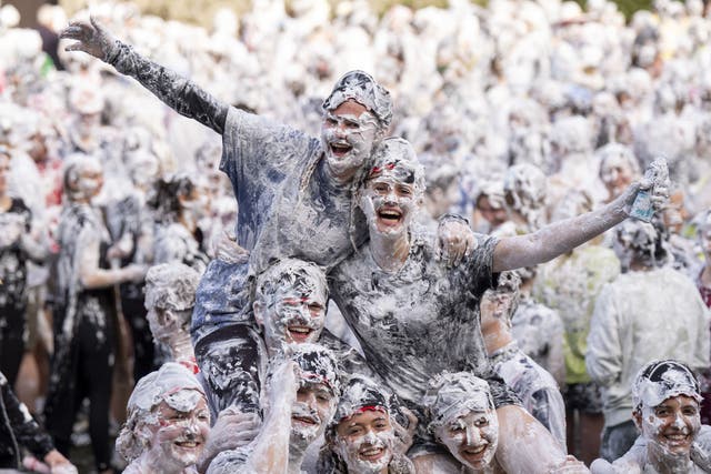 Students take part in the traditional Raisin Monday foam fight (Jane Barlow/PA)
