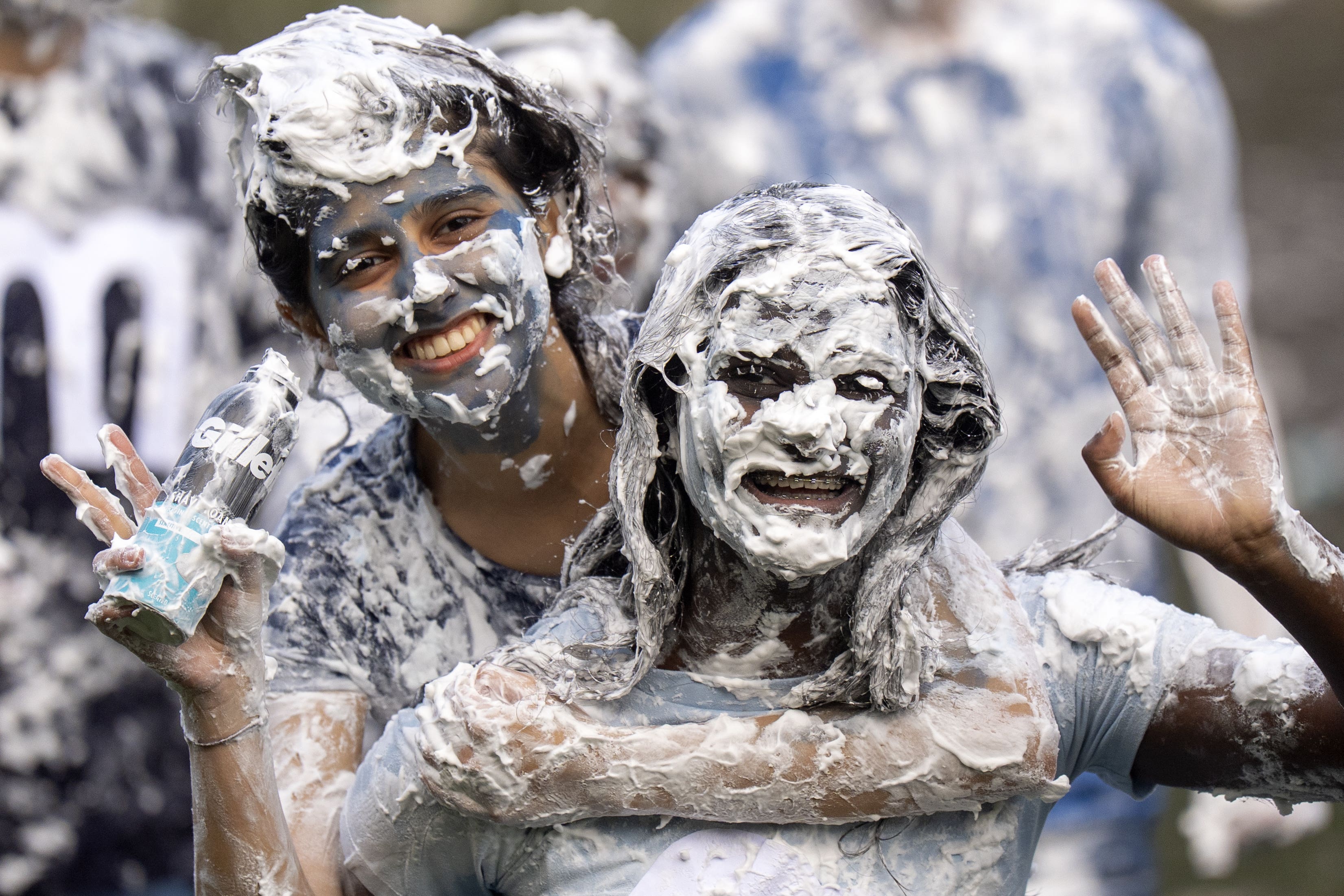 Students take part in the traditional Raisin Monday foam fight on St Salvator’s Lower College Lawn at the University of St Andrews (Jane Barlow/PA)