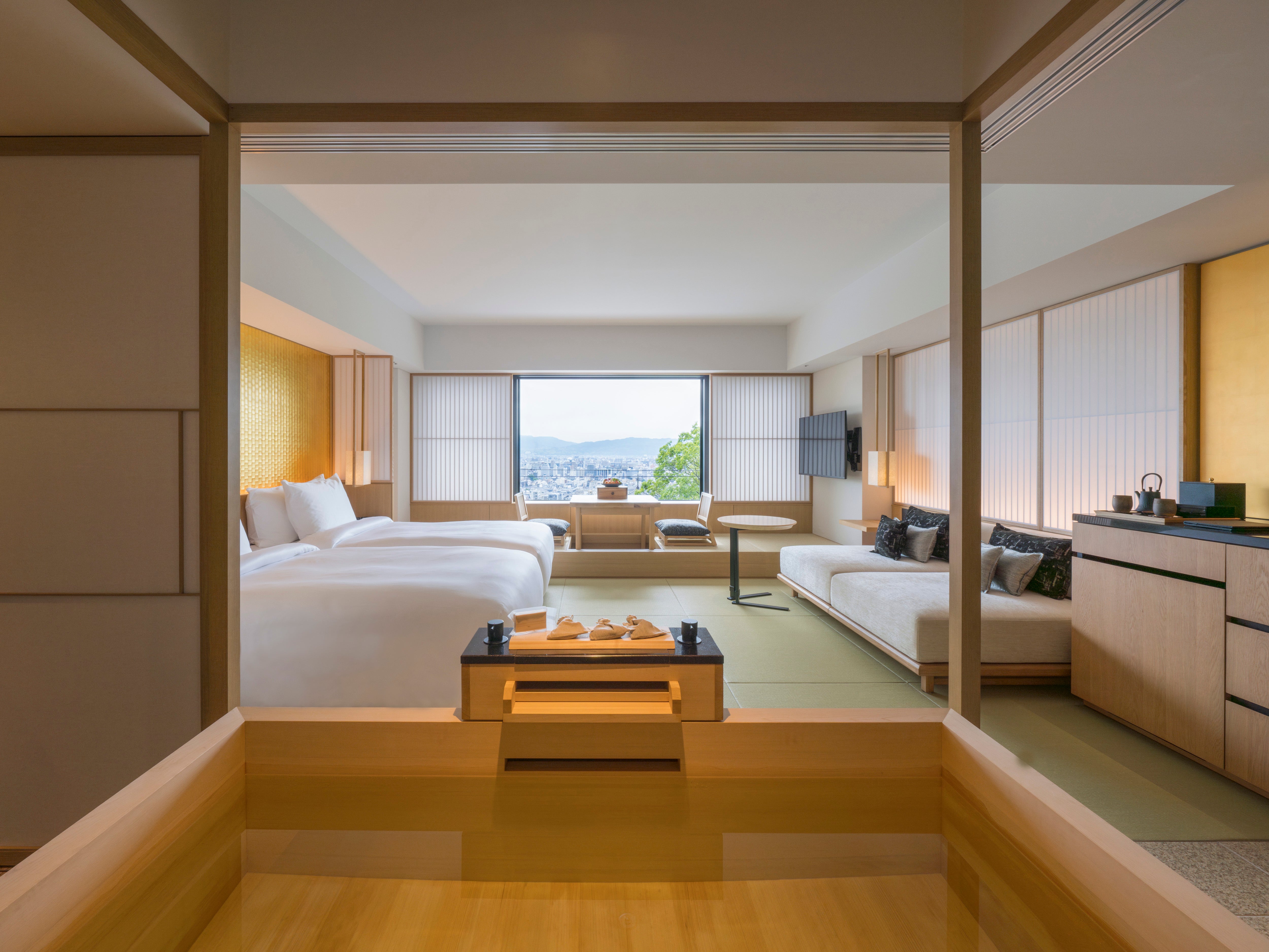 A deep wooden soaking tub can be found in the rooms at Bayan Tree