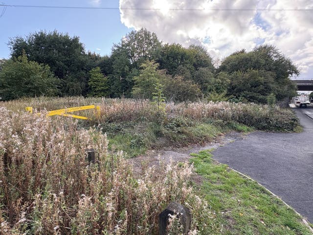 <p>A previously sealed off area of grassland near Tame Road in Oldbury (Matthew Cooper/PA)</p>