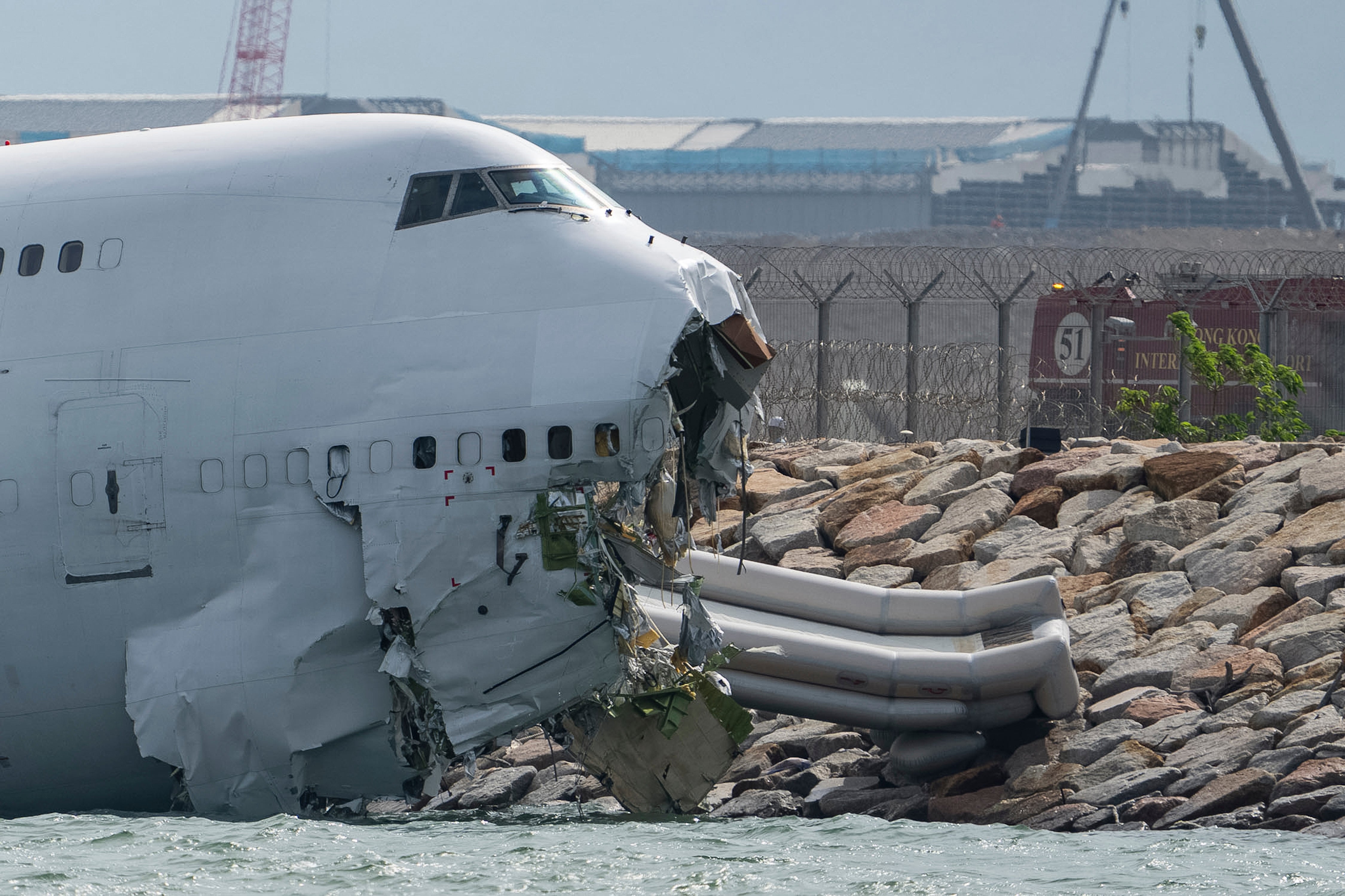 A cargo aircraft skids off a Hong Kong runway into the sea, killing 2  people | The Independent