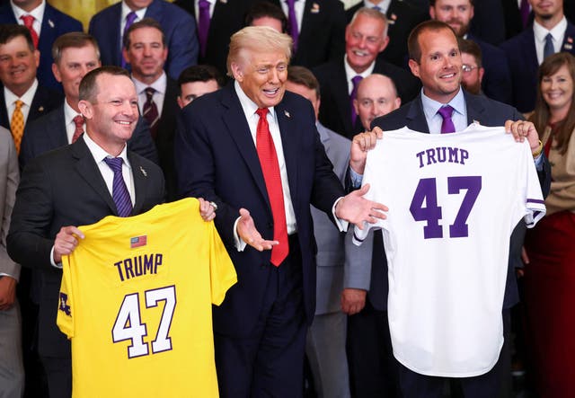 <p>President Donald Trump receives jerseys from LSU coaches Brad Neffendorf and Jay Johnson</p>