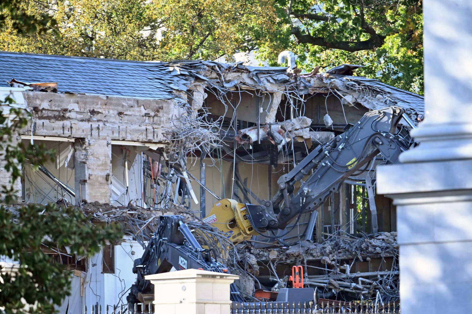 Heavy machinery tears down a section of the East Wing of the White House as construction begins on President Donald Trump's $250 million planned ballroom