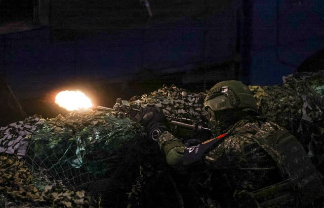 <p>File. Taiwanese soldier fires his weapon during the annual Han Kuang military exercises in Taipei</p>