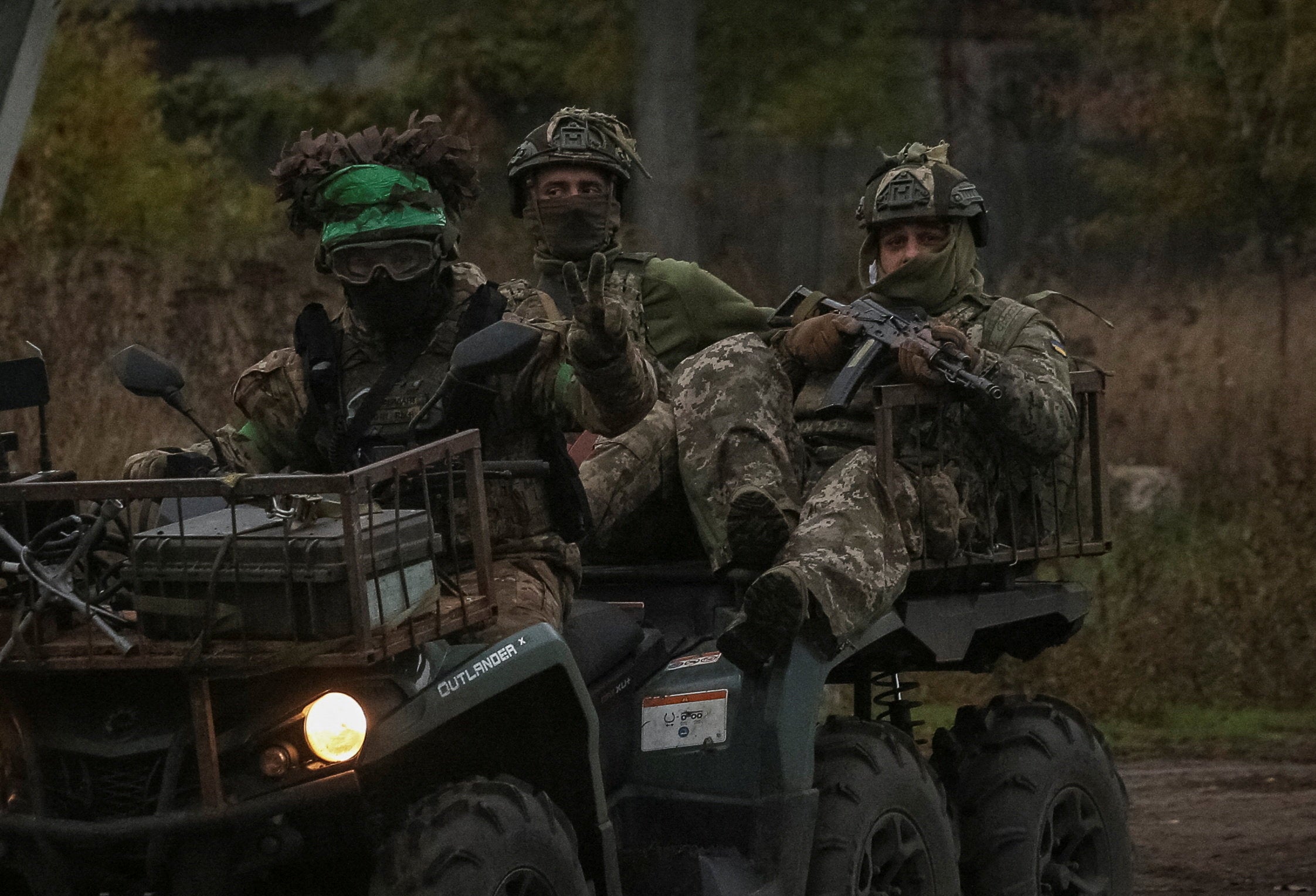 Ukrainian servicemen ride a military buggy, amid Russia's attack on Ukraine, in the Donetsk region