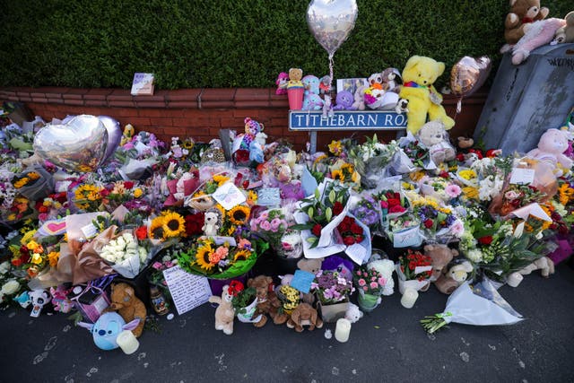 Floral tributes on the junction of Tithebarn Road and Hart Street in Southport (James Speakman/PA)
