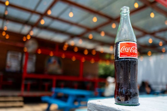 <p>Coca-Cola is rolling out Coke made with American cane sugar after President Donald Trump called on the company to make the change in July</p>