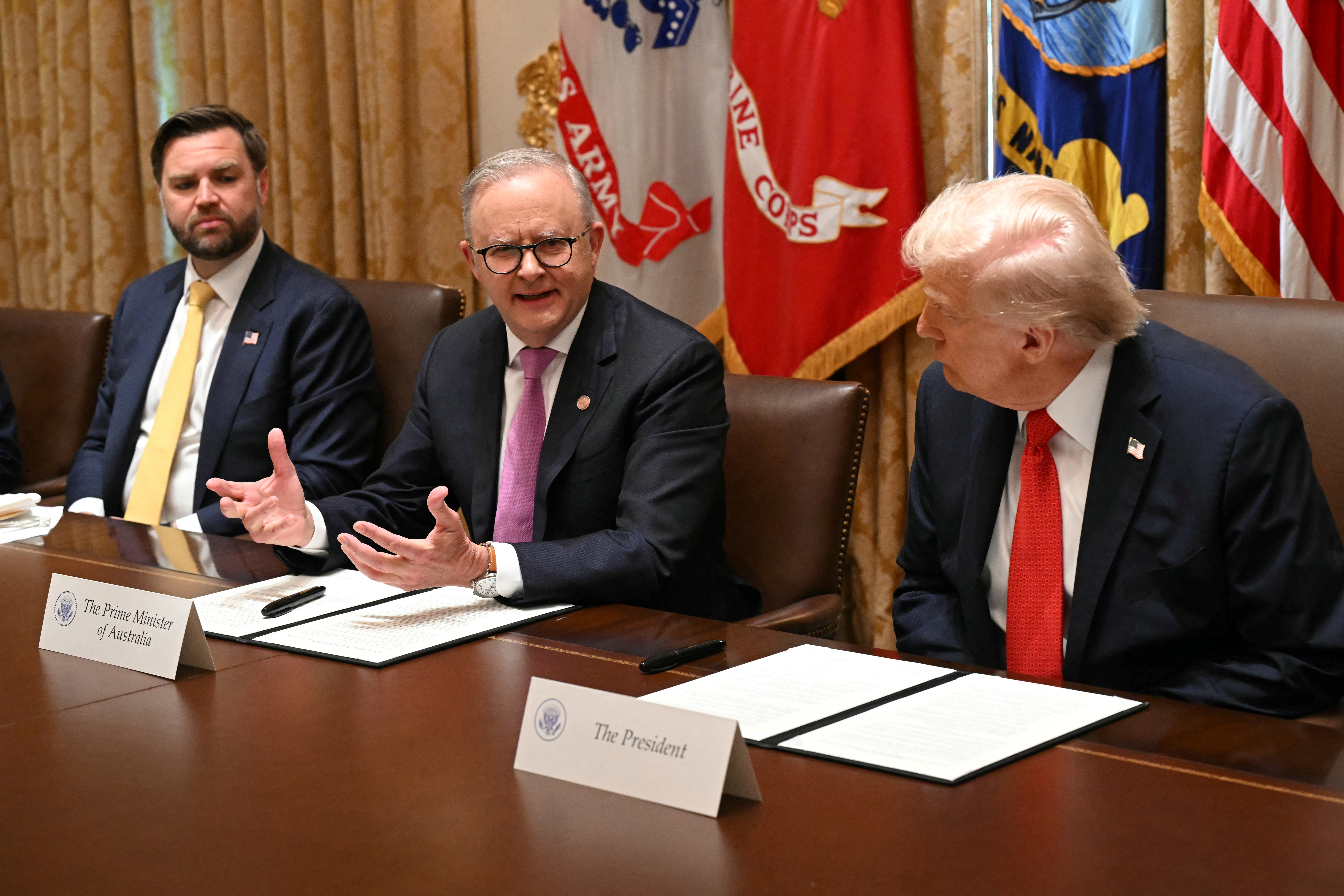 U.S. president Donald Trump (R) listens to Australia’s prime minister Anthony Albanese (C) speak as Vice President JD Vance (L) looks on in the Cabinet Room at the White House in Washington, DC, on 20 October 2025