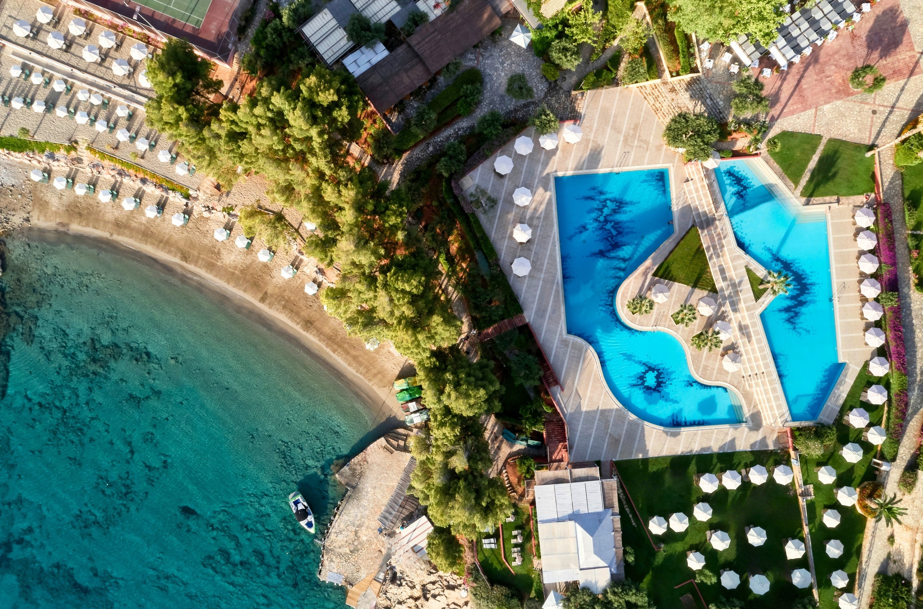 A large pool area has a dedicated kids’ pool and a shallower area in the main pool,