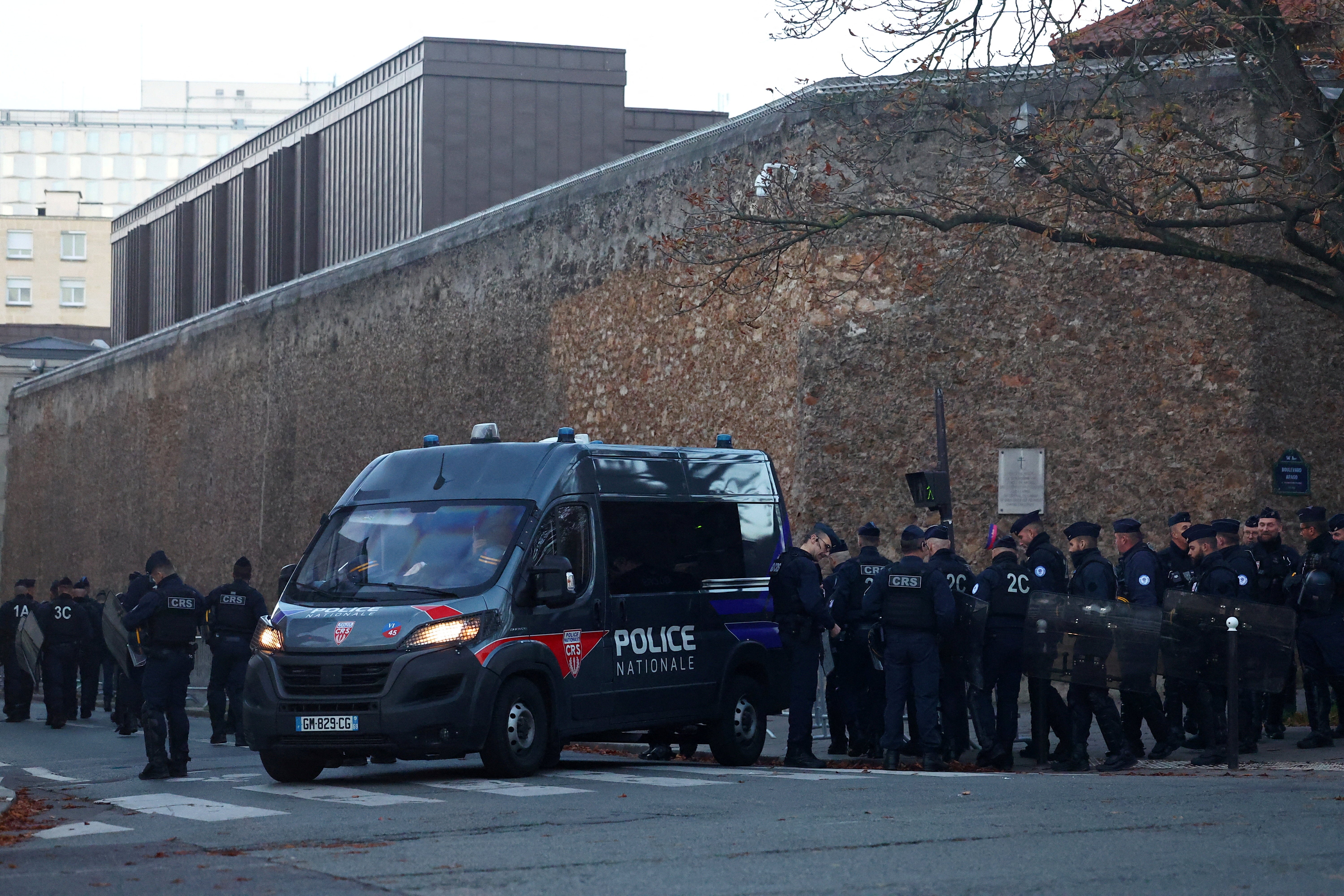 French police secure the area near the Prison de la Sante