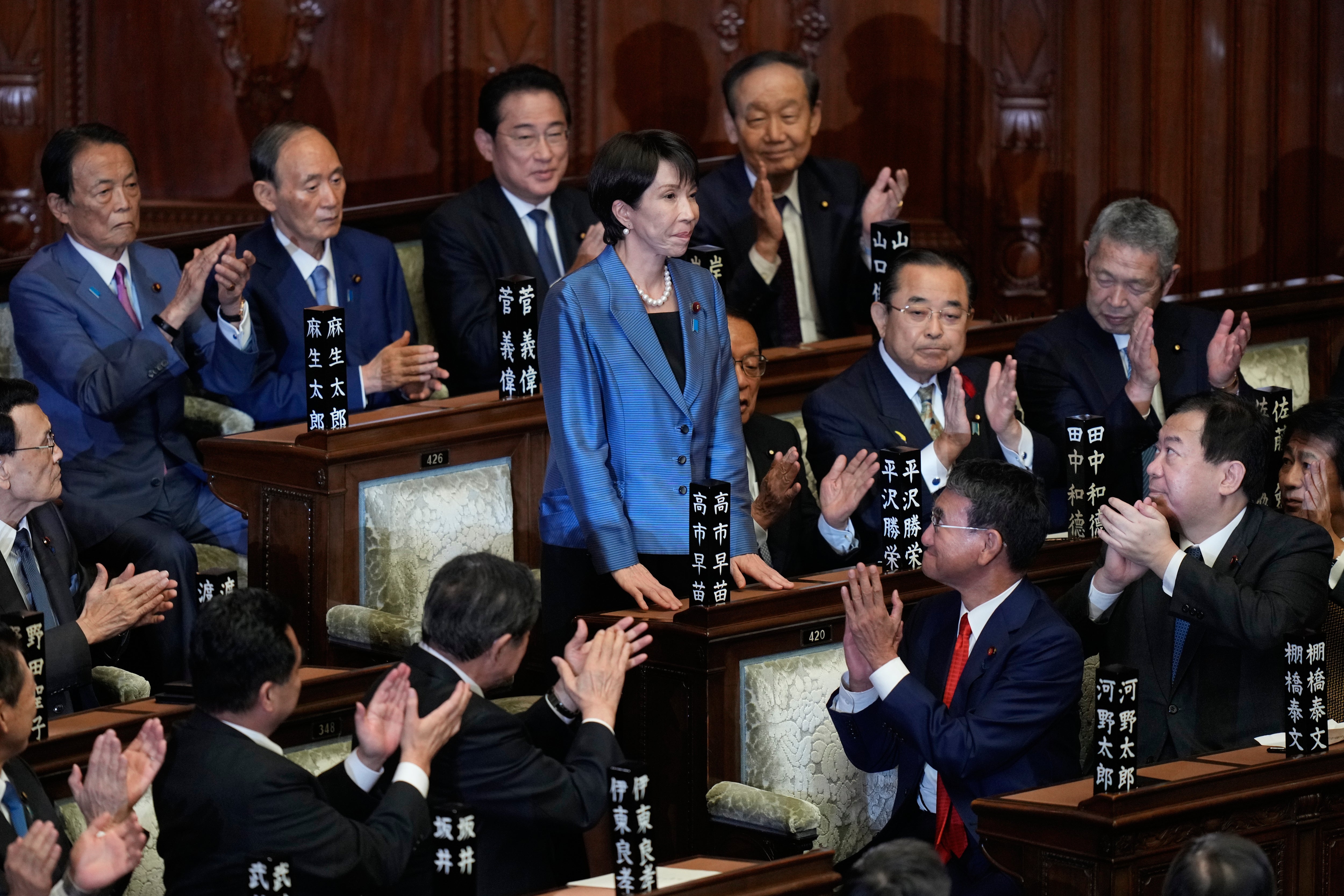 Lawmakers applaud as Sanae Takaichi, centre, was elected as Japan's new prime minister during the extraordinary session of the lower house, in Tokyo, Japan, Tuesday, 21 October 2025