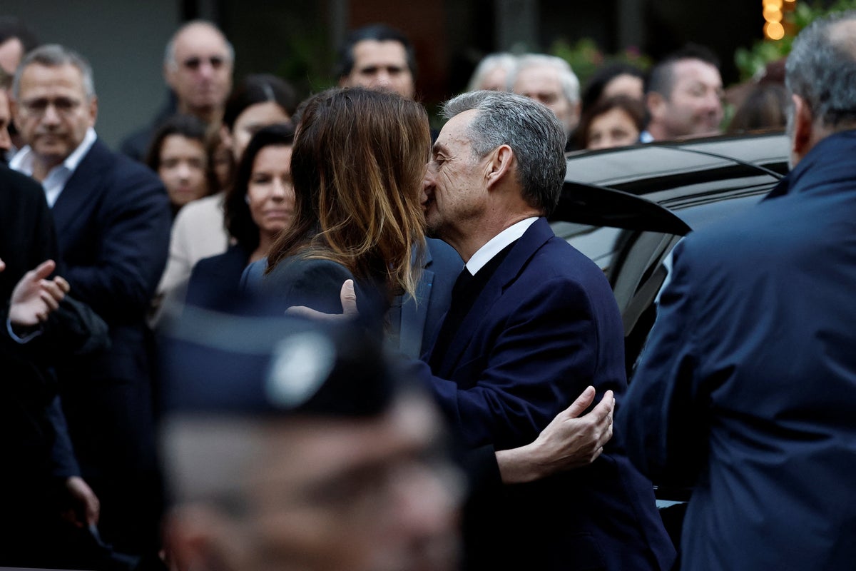 Nicolas Sarkozy shares last kiss with Carla Bruni as he leaves home to begin five-year prison sentence