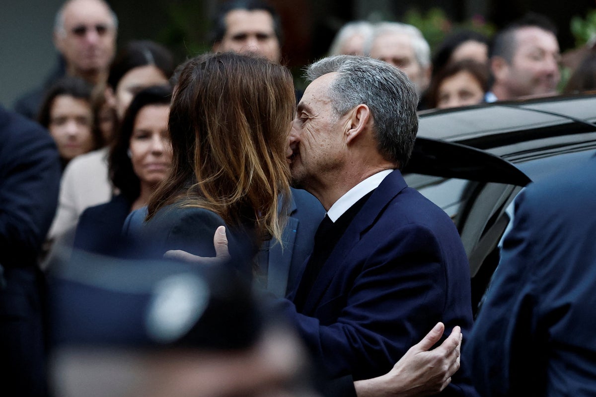 Nicolas Sarkozy shares last kiss with Carla Bruni as he leaves home to begin five-year prison sentence