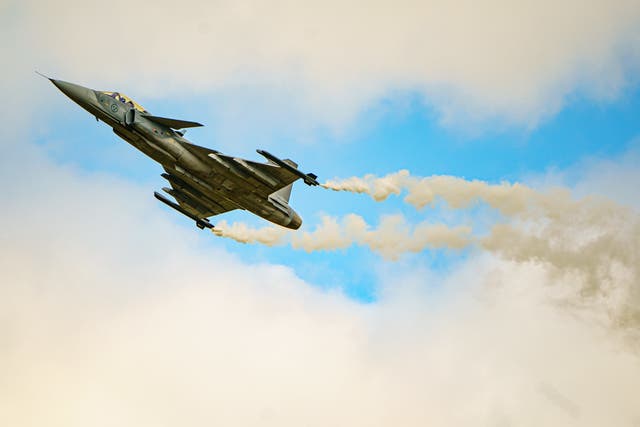 A Saab Gripen performs a slow pass at the Royal International Air Tattoo at RAF Fairford in Gloucestershire (Ben Birchall/PA)