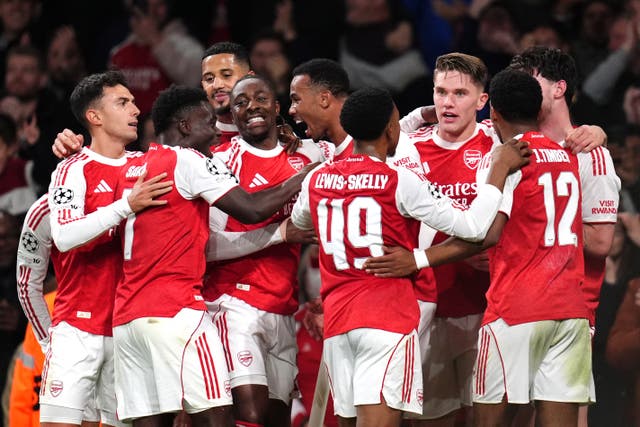 <p>Arsenal players celebrate Gabriel's opener against Atletico Madrid</p>