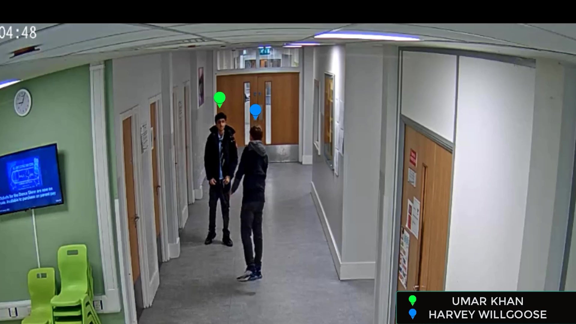 <p>Screengrab taken from CCTV iof Mohammed Umar Khan (green tag) and Harvey Willgoose (blue tag) in the corridor at school before Khan killed his fellow pupil (South Yorkshire Police/PA)</p>