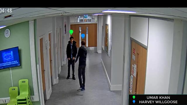 <p>Screengrab taken from CCTV iof Mohammed Umar Khan (green tag) and Harvey Willgoose (blue tag) in the corridor at school before Khan killed his fellow pupil (South Yorkshire Police/PA)</p>